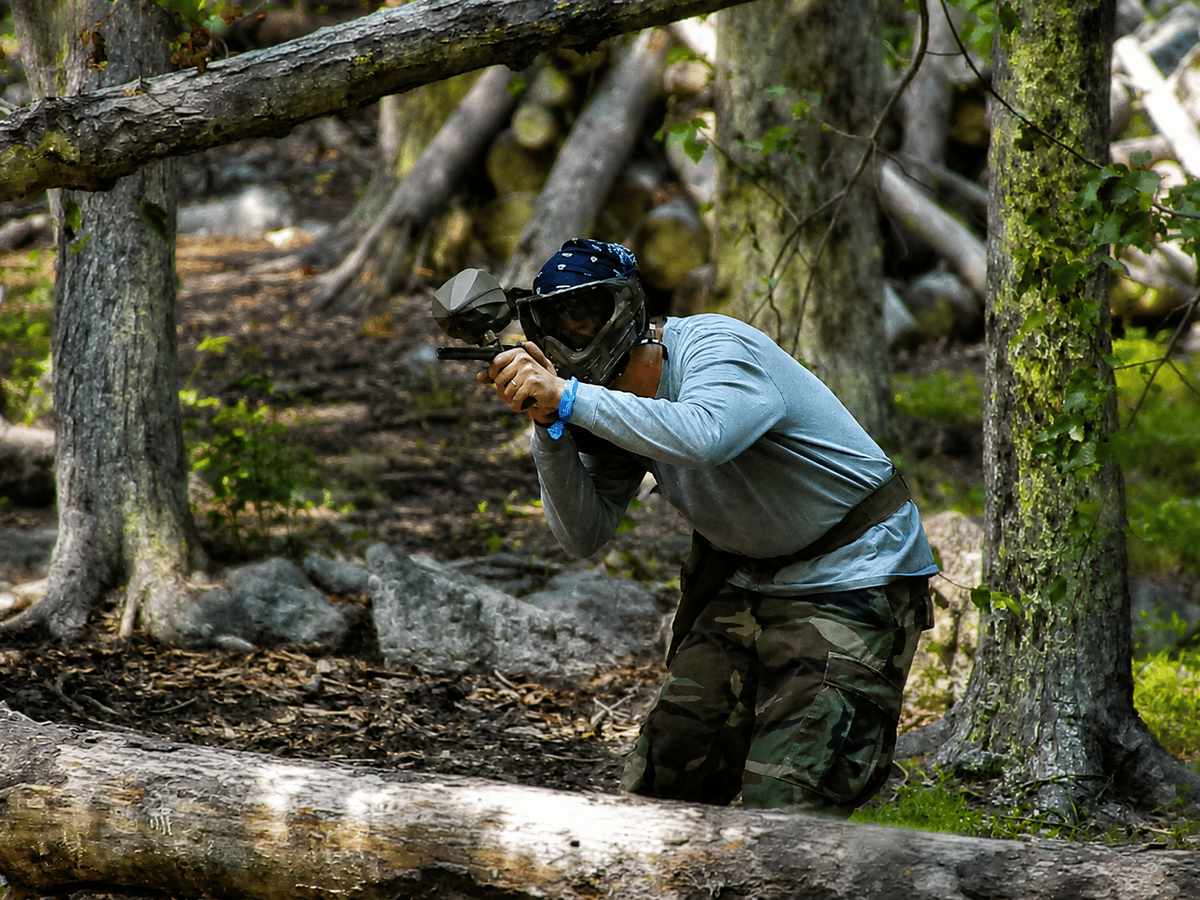 Player aiming through the woods